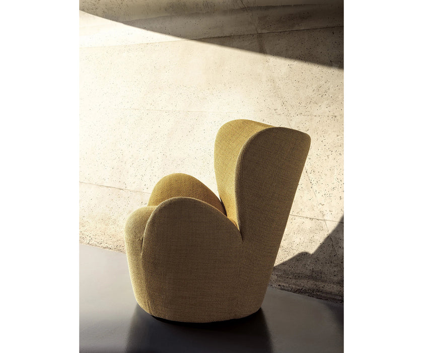 Libelle Armchair by Frigerio featuring a sculptural silhouette inspired by dragonfly wings, upholstered seating, and contemporary Italian design.