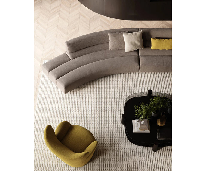 Libelle Armchair by Frigerio featuring a sculptural silhouette inspired by dragonfly wings, upholstered seating, and contemporary Italian design.