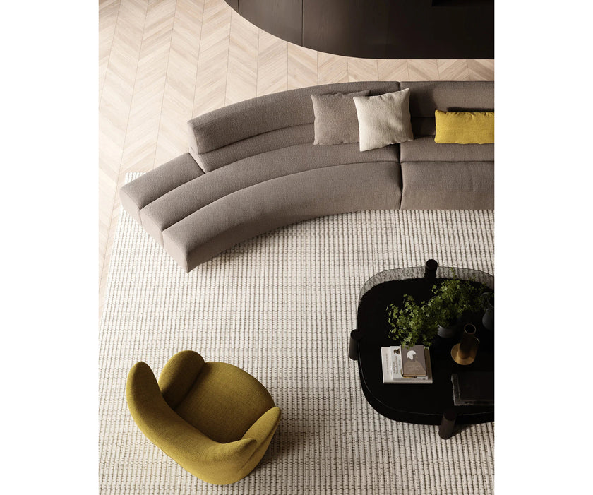 Libelle Armchair by Frigerio featuring a sculptural silhouette inspired by dragonfly wings, upholstered seating, and contemporary Italian design.