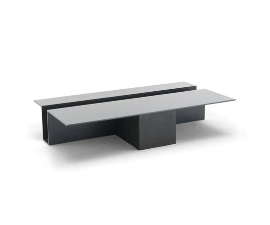 Grek Coffee Table by Living Divani featuring a sculptural design with an integrated magazine holder.