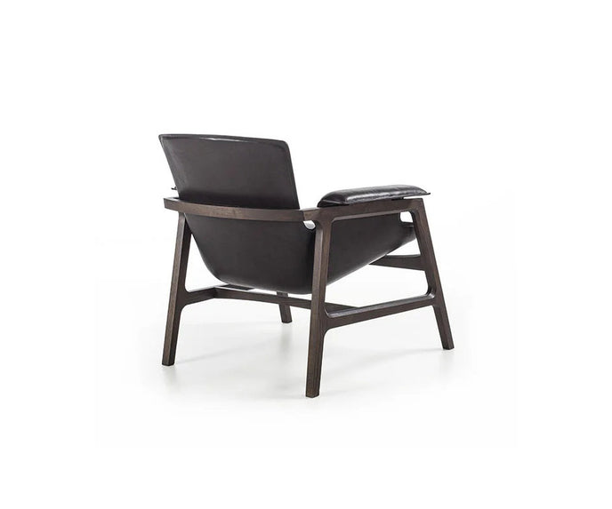 Luxury Arianna armchair by Frigerio with a solid ashwood frame and premium fabric or leather upholstery at Casa Design Group.