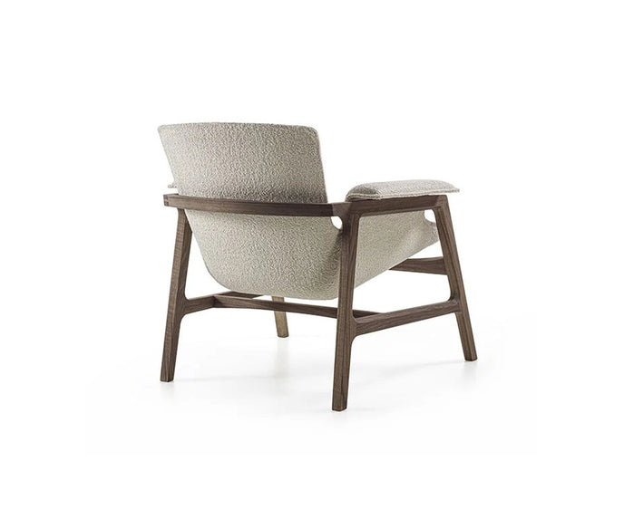 Luxury Arianna armchair by Frigerio with a solid ashwood frame and premium fabric or leather upholstery at Casa Design Group.