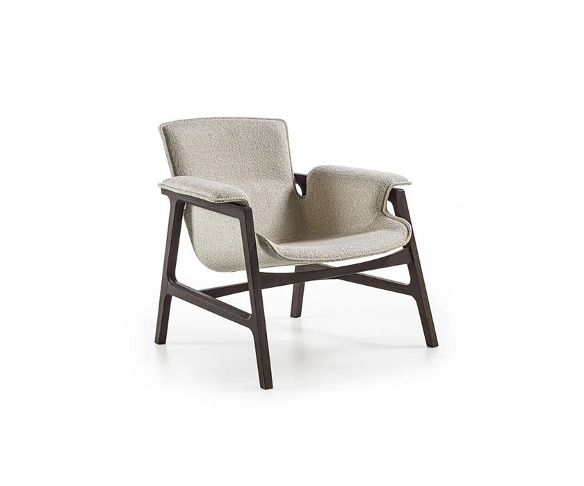 Luxury Arianna armchair by Frigerio with a solid ashwood frame and premium fabric or leather upholstery at Casa Design Group.