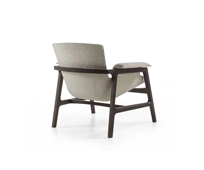 Luxury Arianna armchair by Frigerio with a solid ashwood frame and premium fabric or leather upholstery at Casa Design Group.
