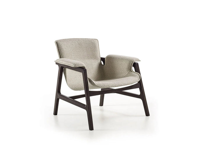 Luxury Arianna armchair by Frigerio with a solid ashwood frame and premium fabric or leather upholstery at Casa Design Group.