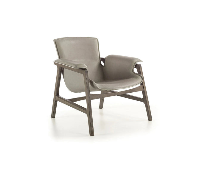 Luxury Arianna armchair by Frigerio with a solid ashwood frame and premium fabric or leather upholstery at Casa Design Group.