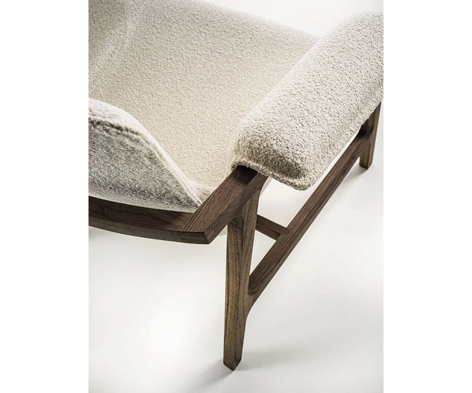 Luxury Arianna armchair by Frigerio with a solid ashwood frame and premium fabric or leather upholstery at Casa Design Group.