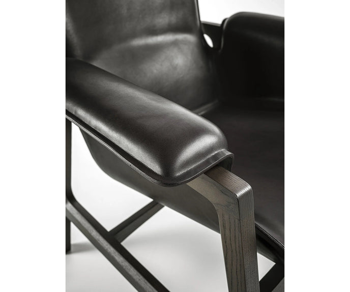 Luxury Arianna armchair by Frigerio with a solid ashwood frame and premium fabric or leather upholstery at Casa Design Group.