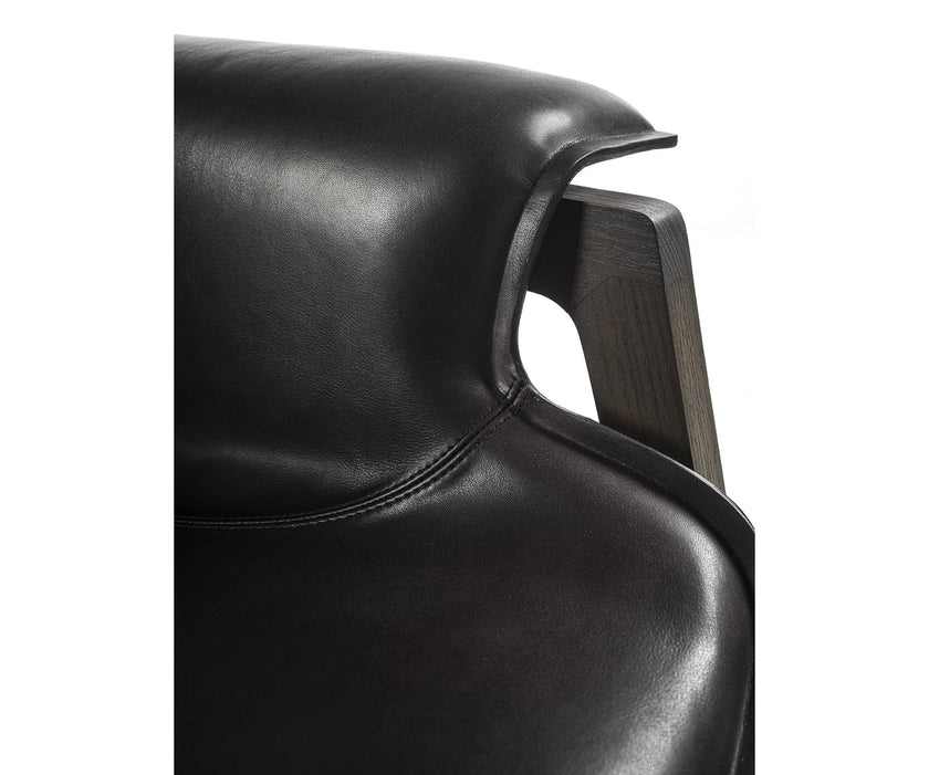 Luxury Arianna armchair by Frigerio with a solid ashwood frame and premium fabric or leather upholstery at Casa Design Group.
