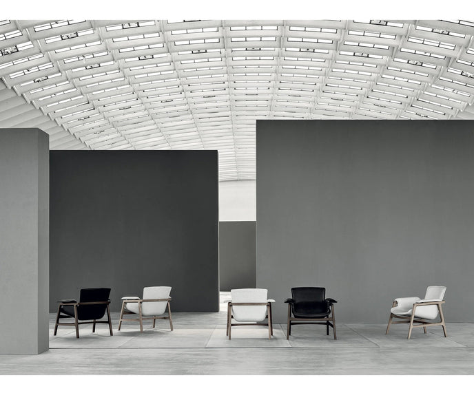 Luxury Arianna armchair by Frigerio with a solid ashwood frame and premium fabric or leather upholstery at Casa Design Group.