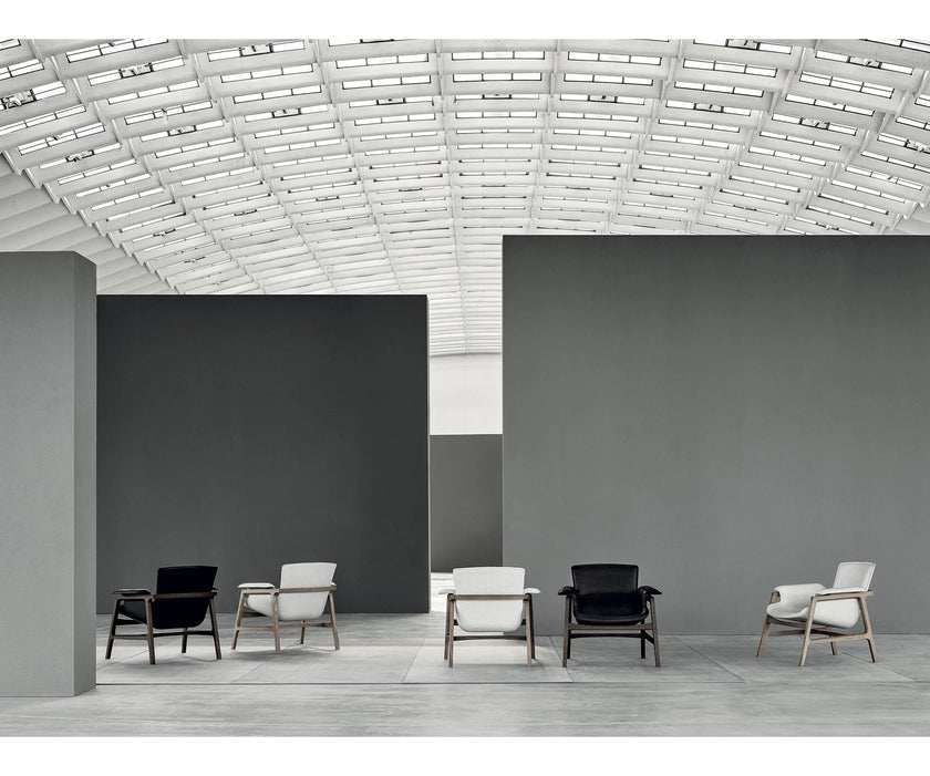 Luxury Arianna armchair by Frigerio with a solid ashwood frame and premium fabric or leather upholstery at Casa Design Group.