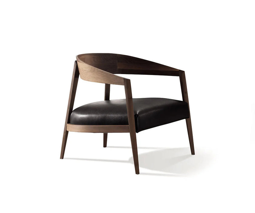 Luxury Lizzye armchair by Frigerio with a solid ashwood frame and premium fabric or leather upholstery | Casa Design Group