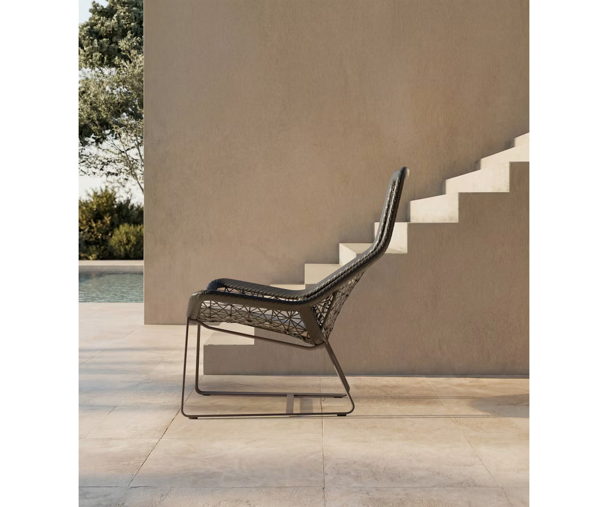 Maia Relax Chair by Kettal featuring a braided Chesnut Maia frame with laminate fabric cushions, modern outdoor lounge chair for luxury patio and terrace spaces | Casa Design Group