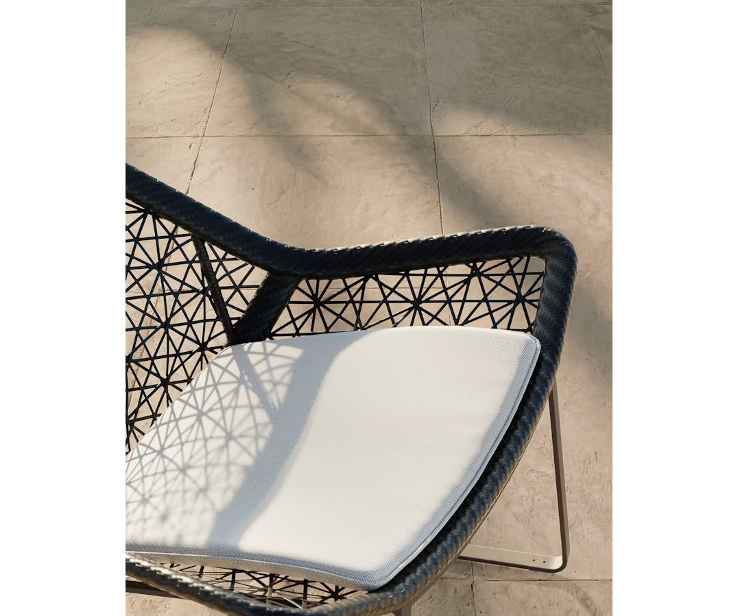 Maia Relax Chair by Kettal featuring a braided Chesnut Maia frame with laminate fabric cushions, modern outdoor lounge chair for luxury patio and terrace spaces | Casa Design Group