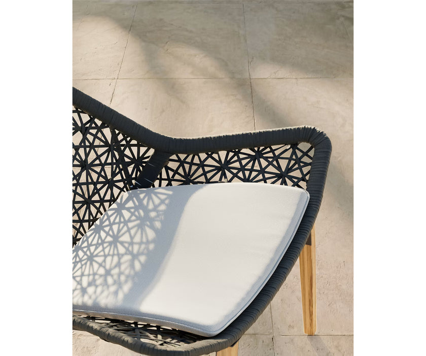 Maia Teak Marengo Relax Chair by Kettal featuring Marengo braided rope, teak legs, and a fog laminate seat cushion, luxury outdoor lounge chair for patios and terraces | Casa Design Group