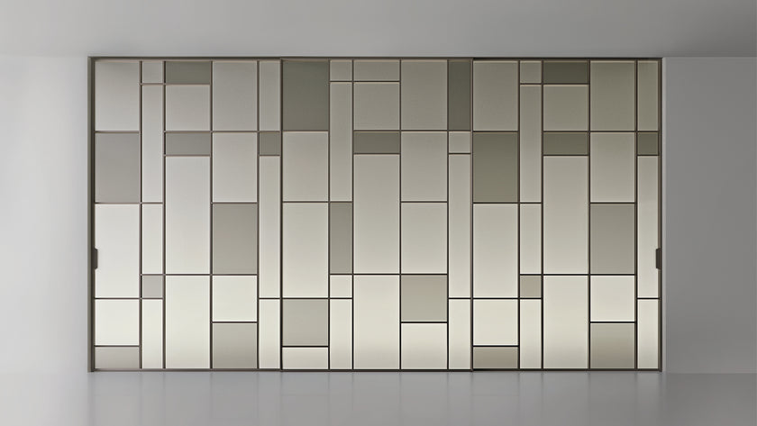 Maxi Sliding Door System with expansive glass panels, aluminum frames and decorative grid patterns by Rimadesio | Casa Design Group