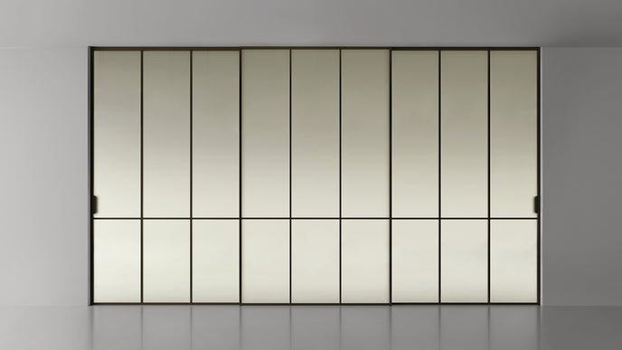 Maxi Sliding Door System with expansive glass panels, aluminum frames and decorative grid patterns by Rimadesio | Casa Design Group