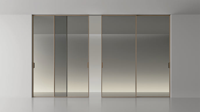 Maxi Sliding Door System with expansive glass panels, aluminum frames and decorative grid patterns by Rimadesio | Casa Design Group