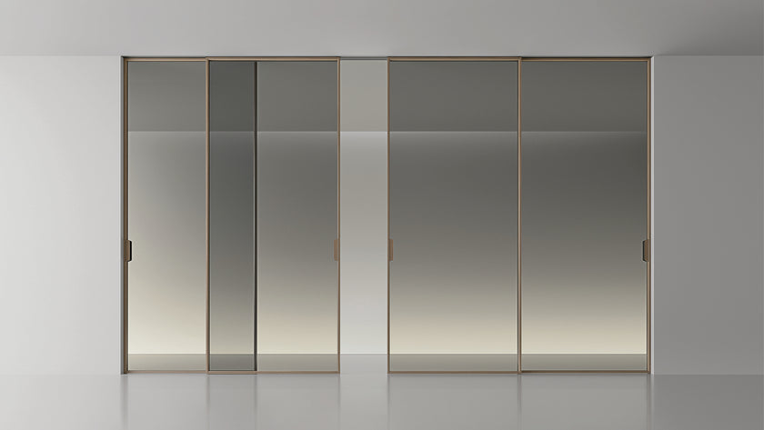 Maxi Sliding Door System with expansive glass panels, aluminum frames and decorative grid patterns by Rimadesio | Casa Design Group