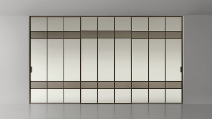 Maxi Sliding Door System with expansive glass panels, aluminum frames and decorative grid patterns by Rimadesio | Casa Design Group