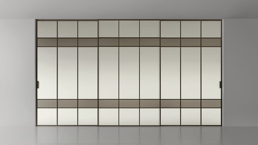 Maxi Sliding Door System with expansive glass panels, aluminum frames and decorative grid patterns by Rimadesio | Casa Design Group