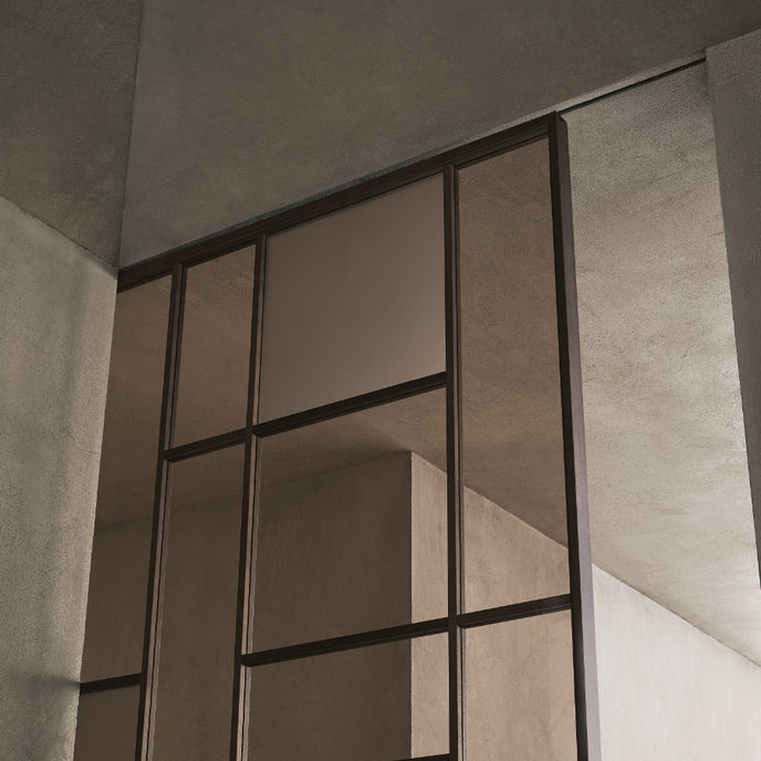 Maxi Sliding Door System with expansive glass panels, aluminum frames and decorative grid patterns by Rimadesio | Casa Design Group