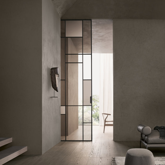 Maxi Sliding Door System with expansive glass panels, aluminum frames and decorative grid patterns by Rimadesio | Casa Design Group