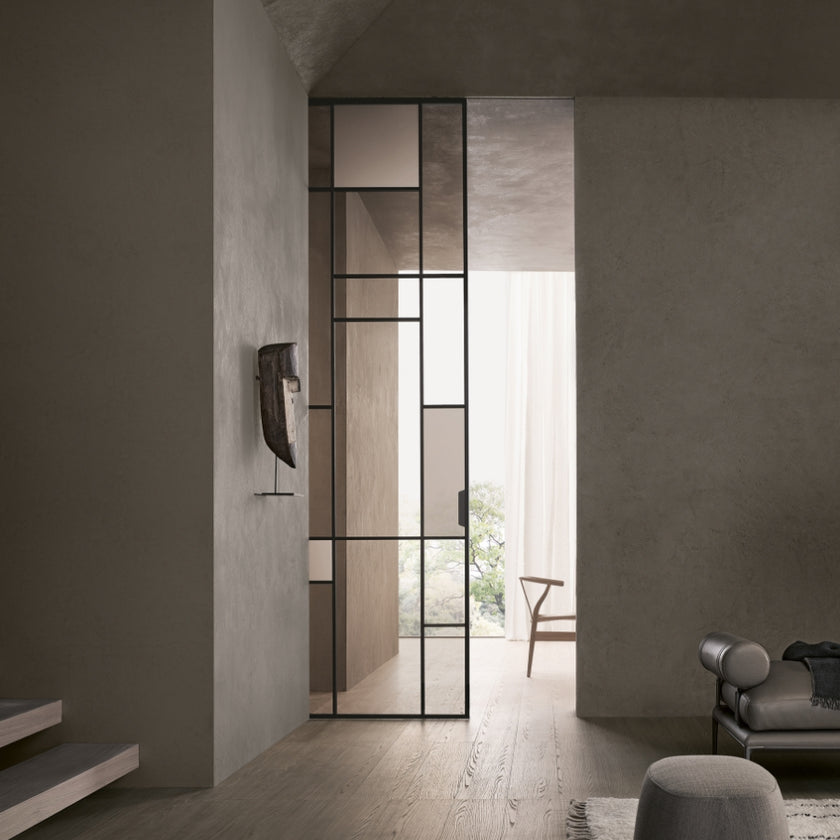 Maxi Sliding Door System with expansive glass panels, aluminum frames and decorative grid patterns by Rimadesio | Casa Design Group