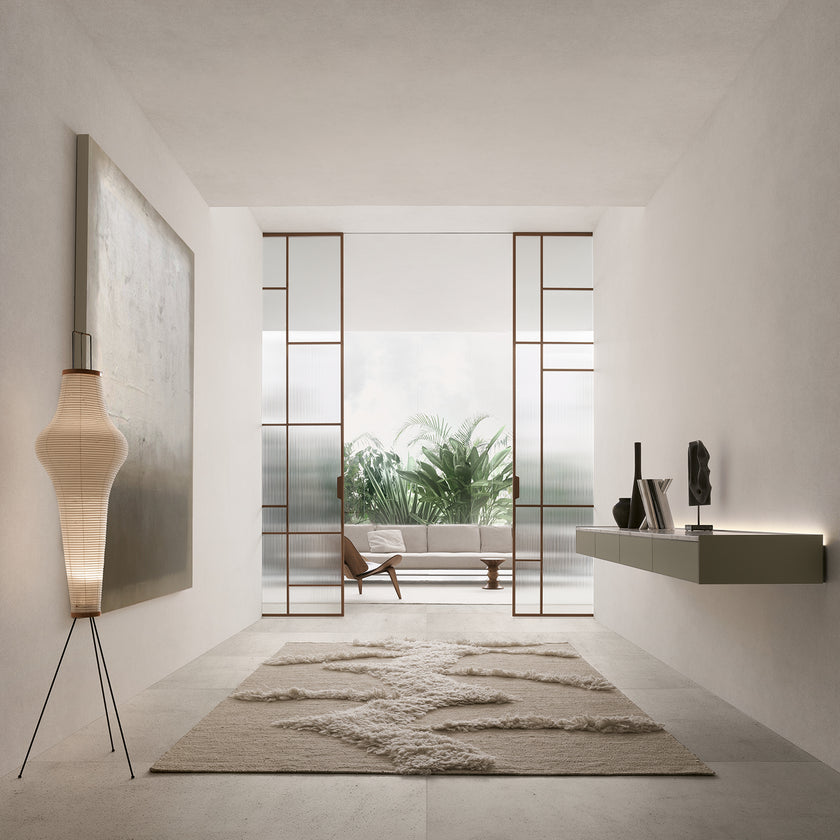 Maxi Sliding Door System with expansive glass panels, aluminum frames and decorative grid patterns by Rimadesio | Casa Design Group