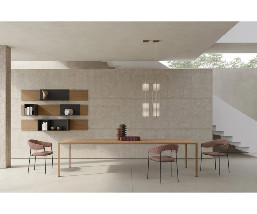 MDF Italia Archie Dining Armchair by Yabu Pushelberg with a tubular steel frame and upholstered seat | Casa Design Group