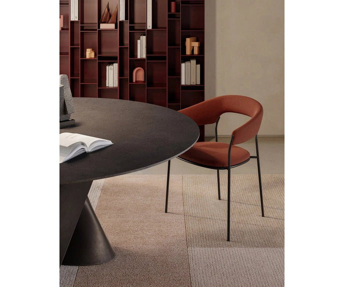 MDF Italia Archie Dining Armchair by Yabu Pushelberg with a tubular steel frame and upholstered seat | Casa Design Group
