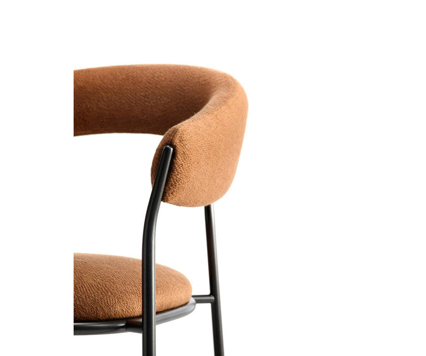 MDF Italia Archie Dining Armchair by Yabu Pushelberg with a tubular steel frame and upholstered seat | Casa Design Group