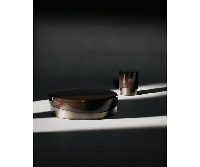 Merian Coffee Table by Capital with a glossy lacquered round top and metallic base.