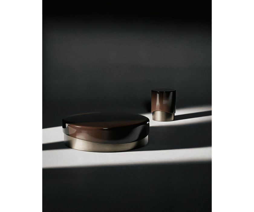 Merian Coffee Table by Capital with a glossy lacquered round top and metallic base.