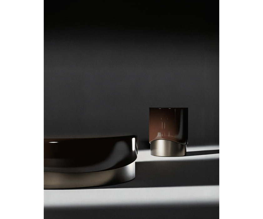 Merian Coffee Table by Capital with a glossy lacquered round top and metallic base.