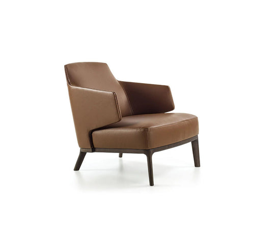 Amanda Lounge Chair by Frigerio featuring sculptural suspended armrests, a solid ashwood base, and premium Italian upholstery | Casa Design Group