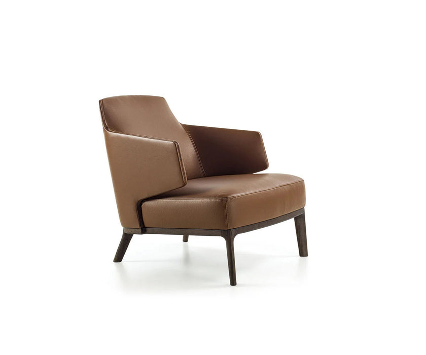 Amanda Lounge Chair by Frigerio featuring sculptural suspended armrests, a solid ashwood base, and premium Italian upholstery | Casa Design Group