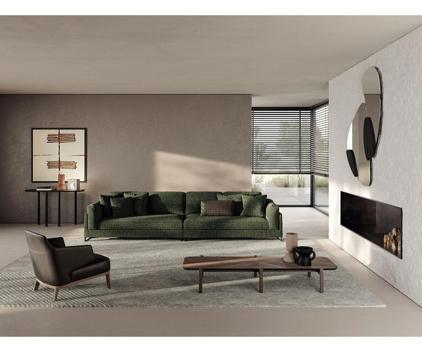 Amanda Lounge Chair by Frigerio featuring sculptural suspended armrests, a solid ashwood base, and premium Italian upholstery | Casa Design Group