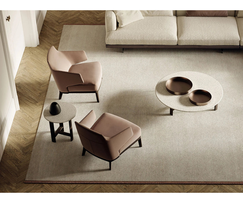 Amanda Lounge Chair by Frigerio featuring sculptural suspended armrests, a solid ashwood base, and premium Italian upholstery | Casa Design Group
