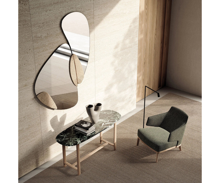 Amanda Lounge Chair by Frigerio featuring sculptural suspended armrests, a solid ashwood base, and premium Italian upholstery | Casa Design Group