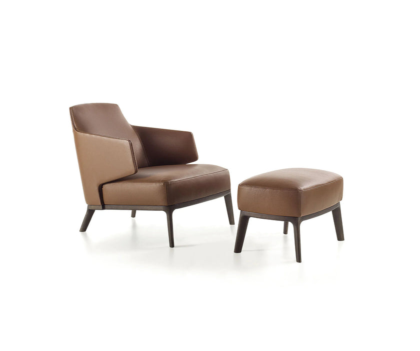 Amanda Lounge Chair by Frigerio featuring sculptural suspended armrests, a solid ashwood base, and premium Italian upholstery | Casa Design Group