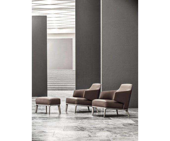 Amanda Lounge Chair by Frigerio featuring sculptural suspended armrests, a solid ashwood base, and premium Italian upholstery | Casa Design Group