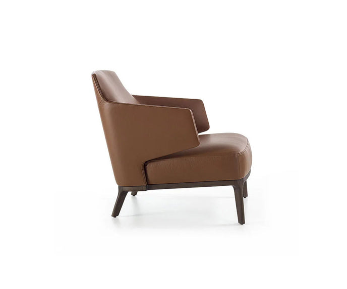 Amanda Lounge Chair by Frigerio featuring sculptural suspended armrests, a solid ashwood base, and premium Italian upholstery | Casa Design Group