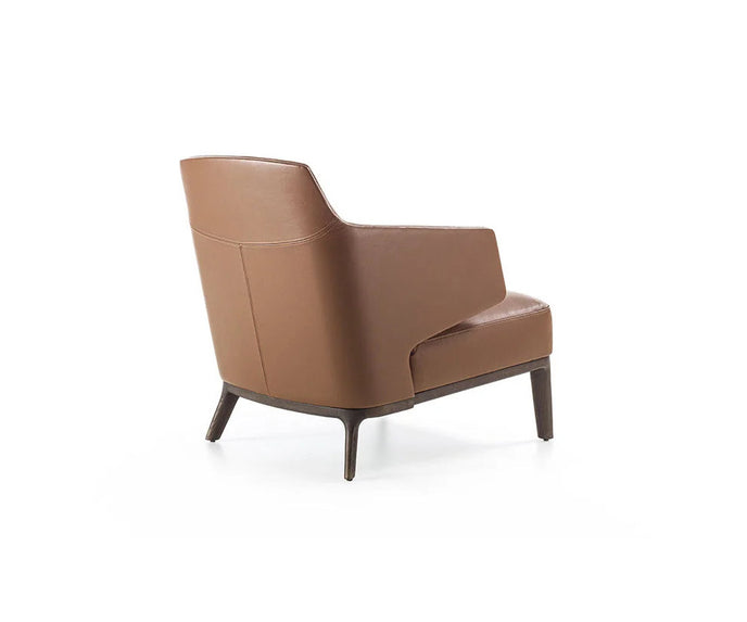 Amanda Lounge Chair by Frigerio featuring sculptural suspended armrests, a solid ashwood base, and premium Italian upholstery | Casa Design Group
