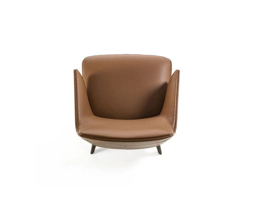 Amanda Lounge Chair by Frigerio featuring sculptural suspended armrests, a solid ashwood base, and premium Italian upholstery | Casa Design Group