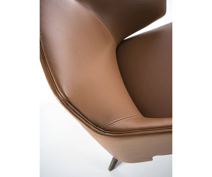 Amanda Lounge Chair by Frigerio featuring sculptural suspended armrests, a solid ashwood base, and premium Italian upholstery | Casa Design Group
