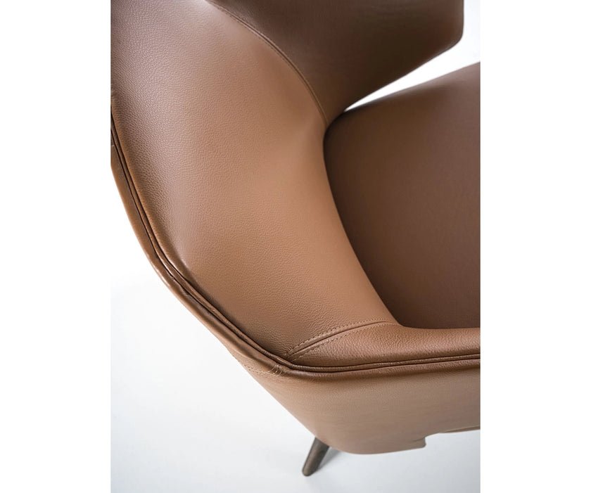 Amanda Lounge Chair by Frigerio featuring sculptural suspended armrests, a solid ashwood base, and premium Italian upholstery | Casa Design Group