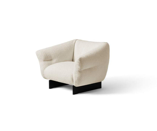 Mon-Cloud Lounge Chair by Cassina designed by Patricia Urquiola with a sculptural upholstered form and wooden base.