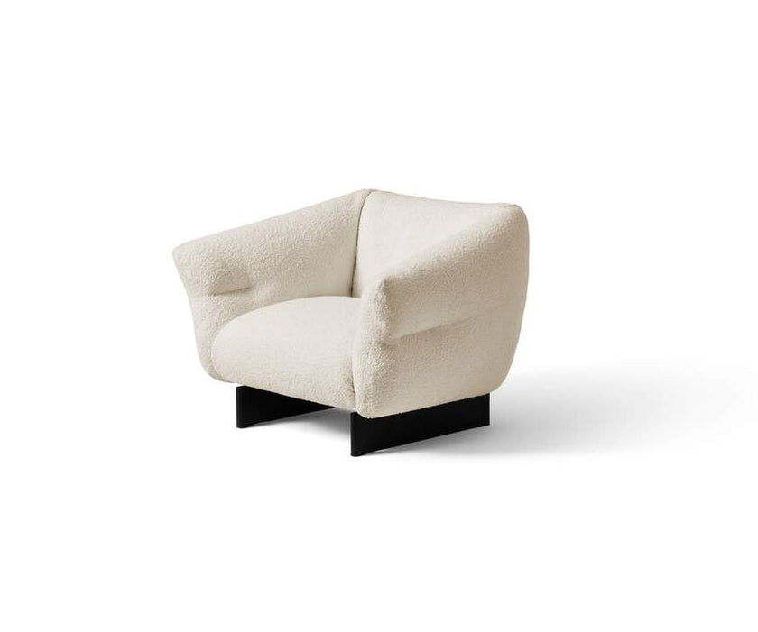 Mon-Cloud Lounge Chair by Cassina designed by Patricia Urquiola with a sculptural upholstered form and wooden base.