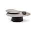 Move Coffee Table by Draenert with rotating natural stone tops and a conical metal base.